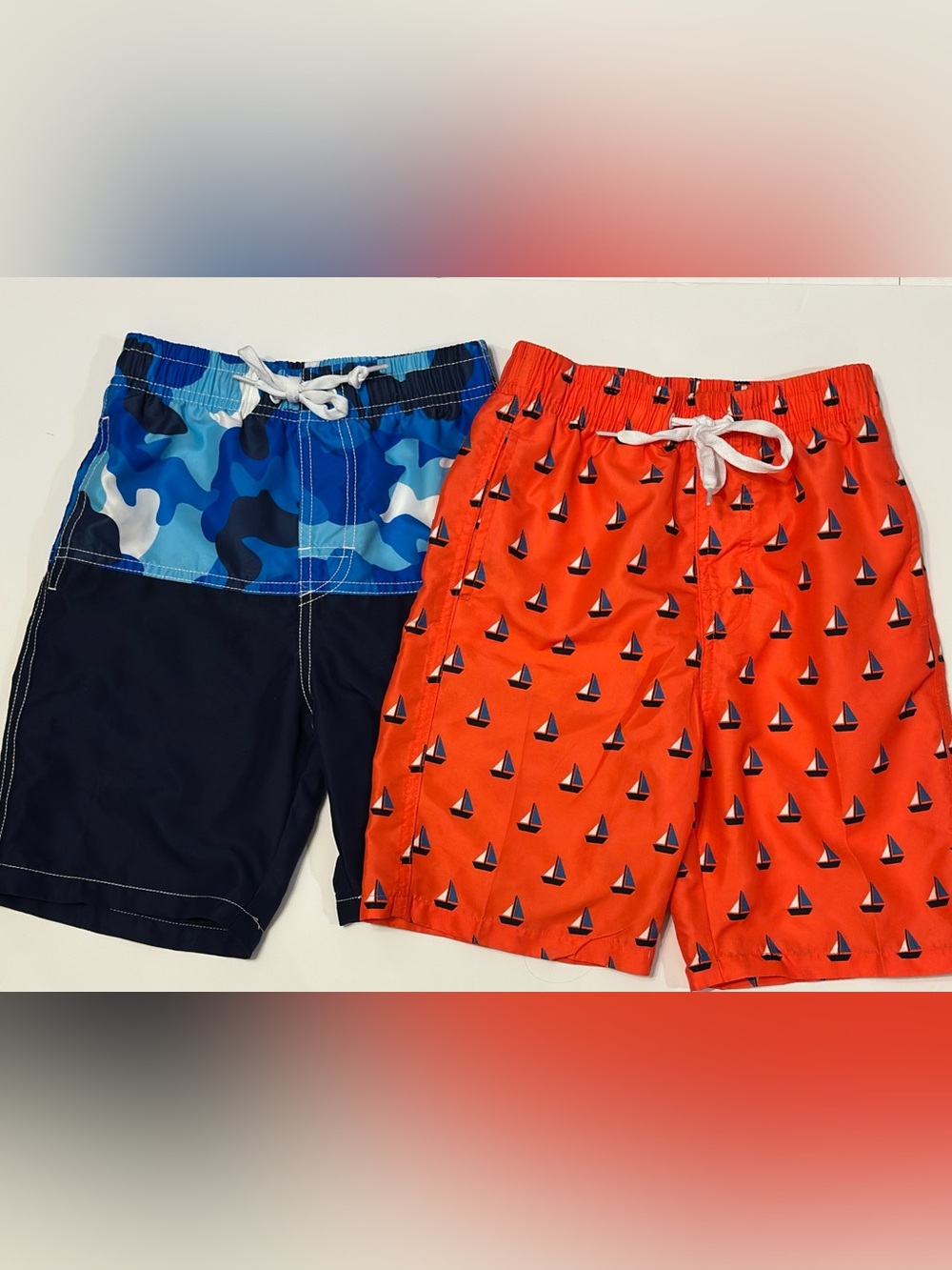 Boys Swim Trunks 2-Pack - Size 7. Navy Camo & Orange Sailboat Print